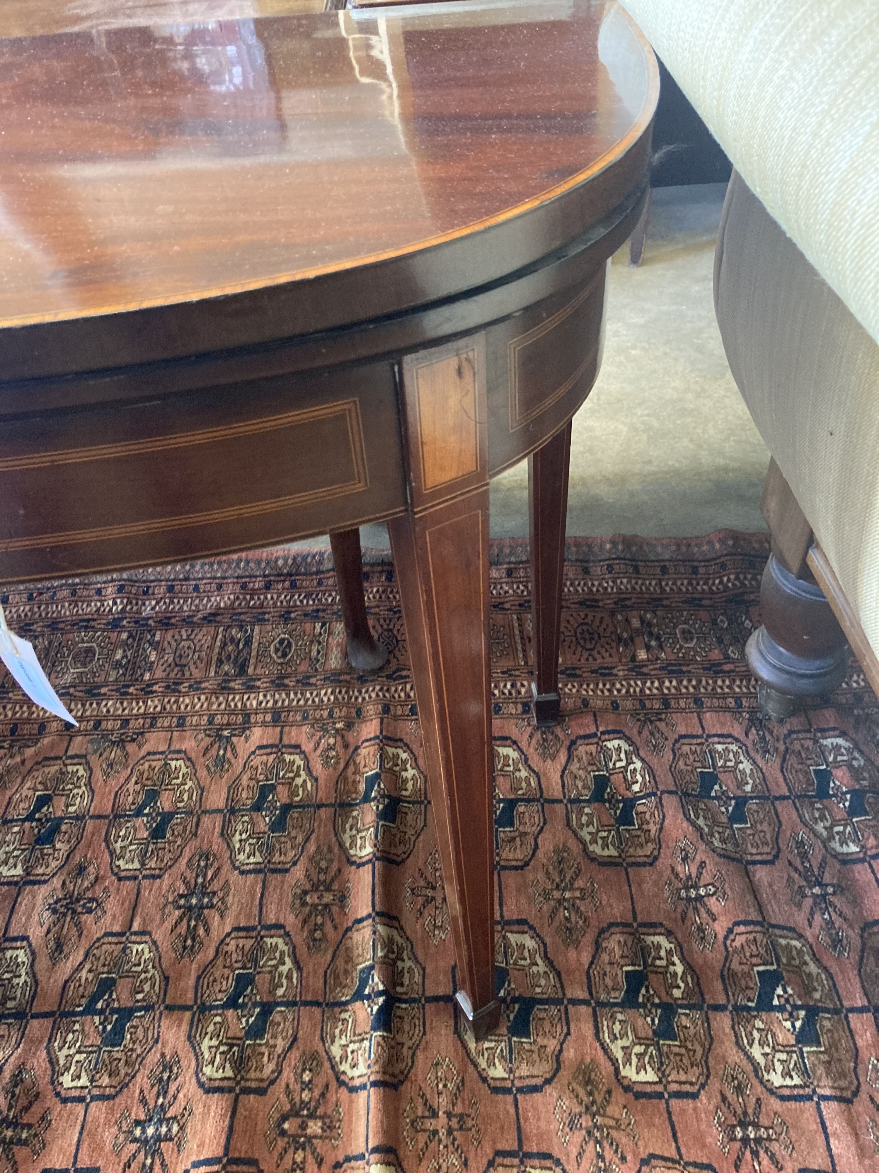 A George III line-inlaid mahogany D-shaped card table with folding top, width 90cm, depth 44cm, height 73cm